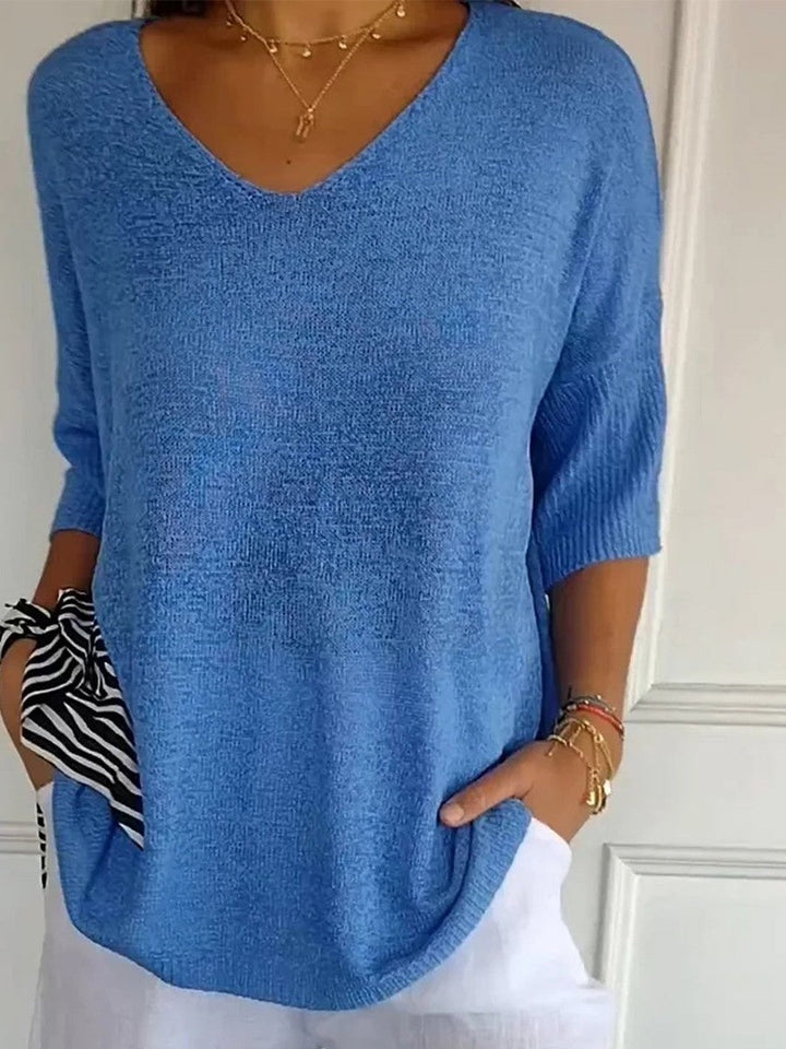 Knit V-neck sweater with 3/4 sleeves and relaxed fit for women