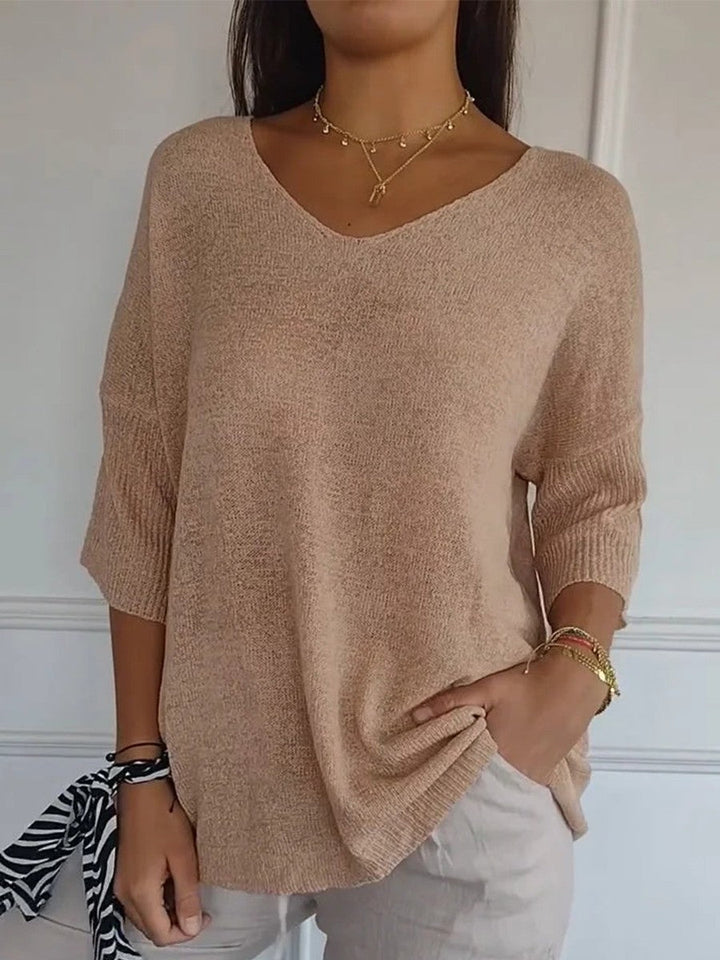Knit V-neck sweater with 3/4 sleeves and relaxed fit for women