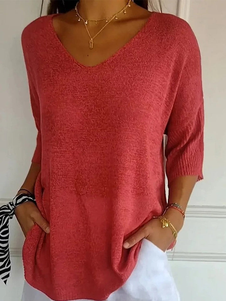Knit V-neck sweater with 3/4 sleeves and relaxed fit for women