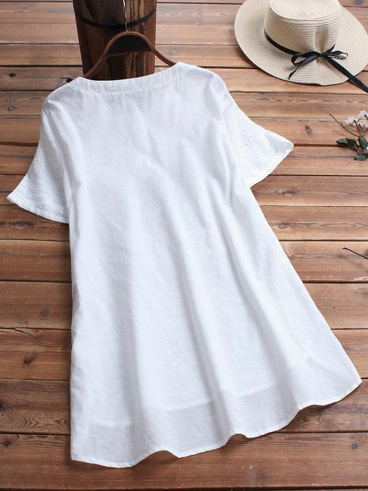 Cotton eyelet tunic top with button detail and short sleeves for women