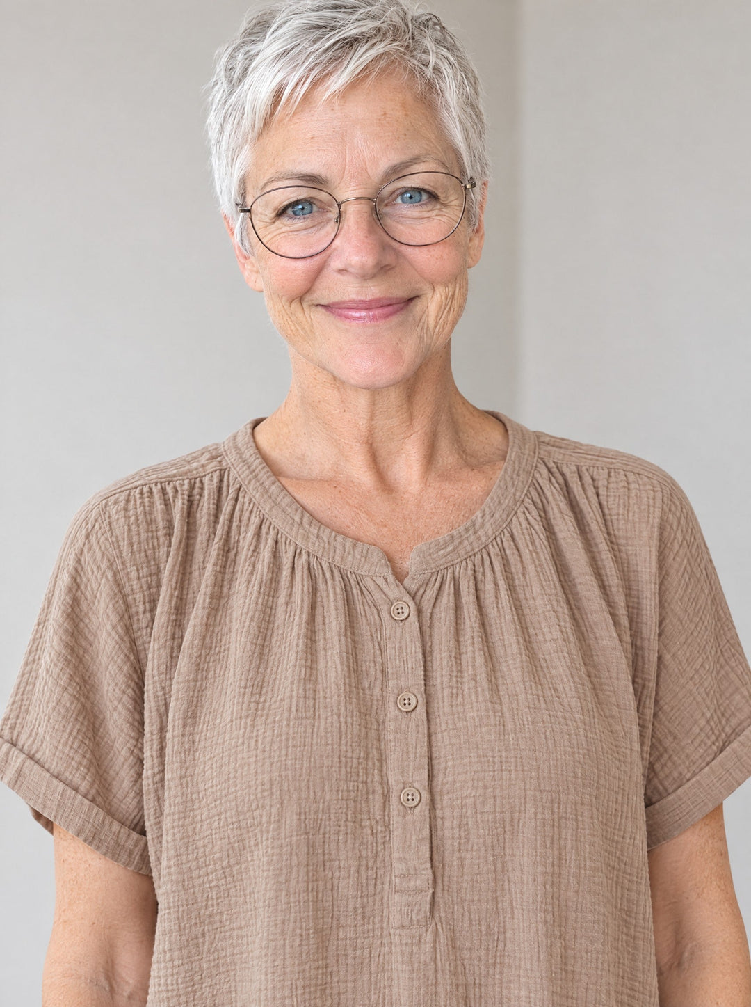 Double-gauze cotton nightdress, close-up of the gathered neckline and buttons