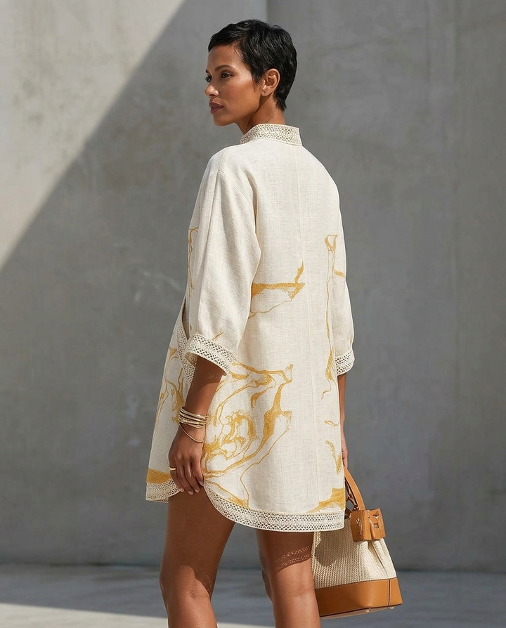 V-neck mini dress with trim detail and flowing fit for women