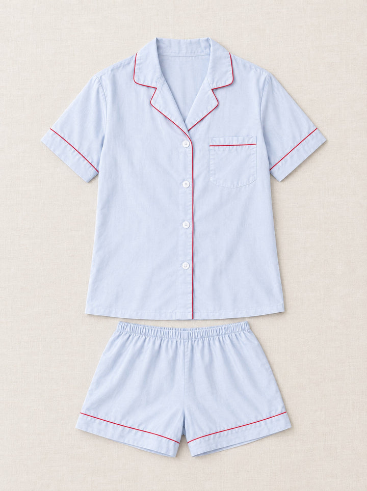 Lyocell short pyjama set with piping in light blue, flat lay