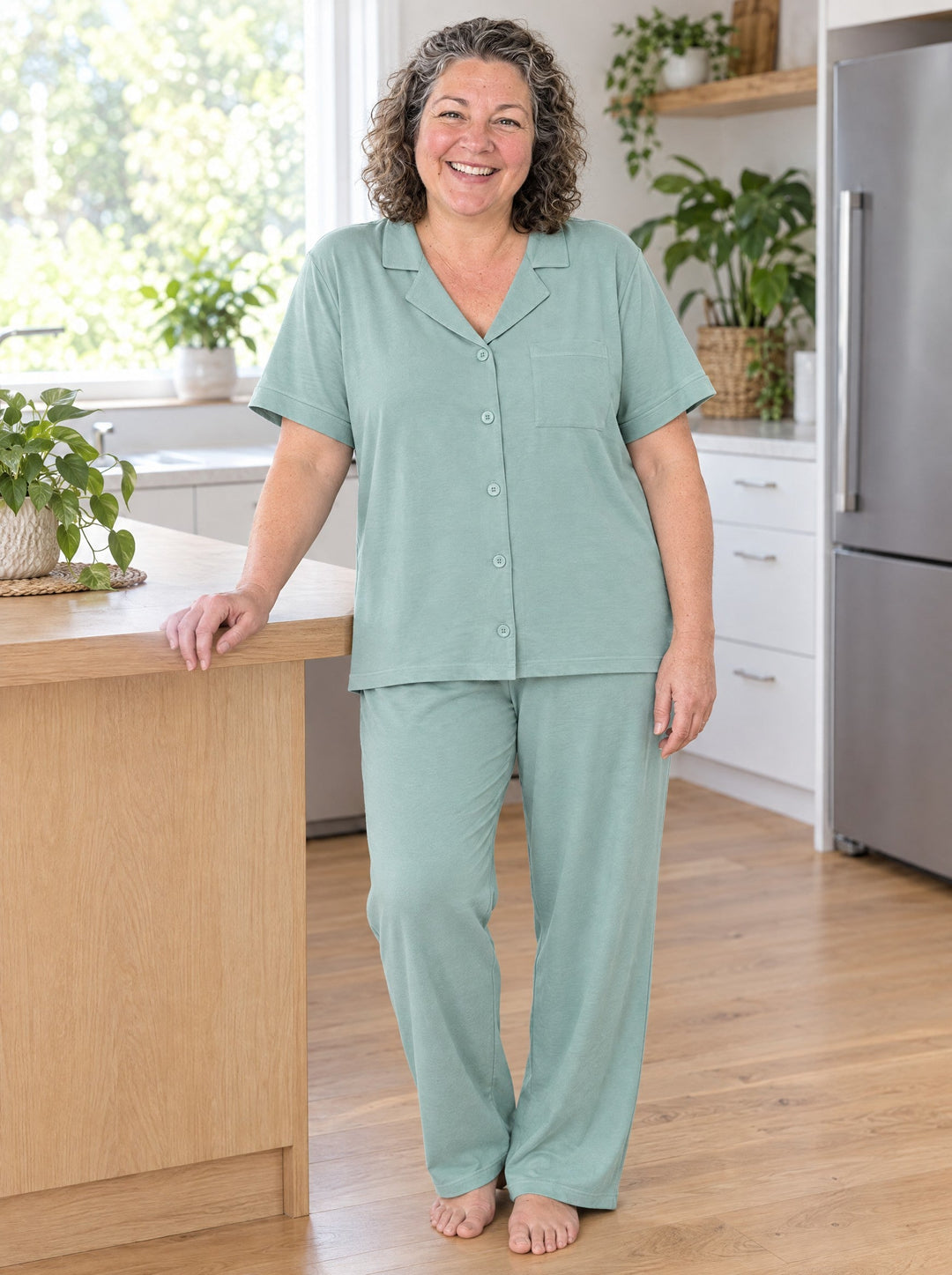Woman wearing the modal-cotton pyjama set in sage